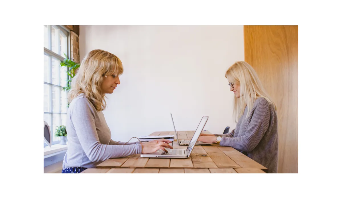An image of two women working at an office.