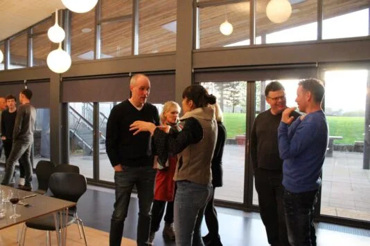 An image of colleagues talking to each other.
