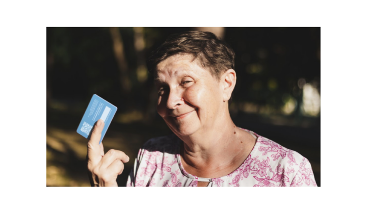 image of a woman holding bank card