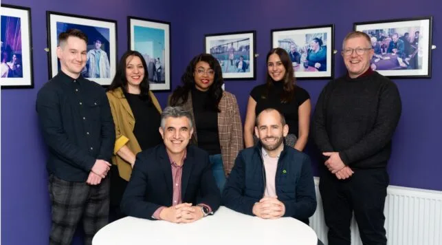 Image of Amiqus team and SRC team announcing partnership.