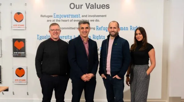 Image of Amiqus team and SRC team announcing partnership.