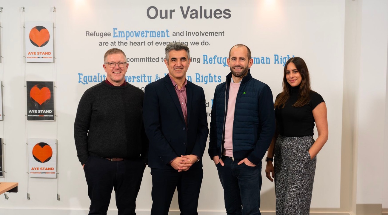 Image of Amiqus team and SRC team announcing partnership.