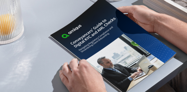 hands holding the Conveyancers' guide to digital KYC and AML checks
