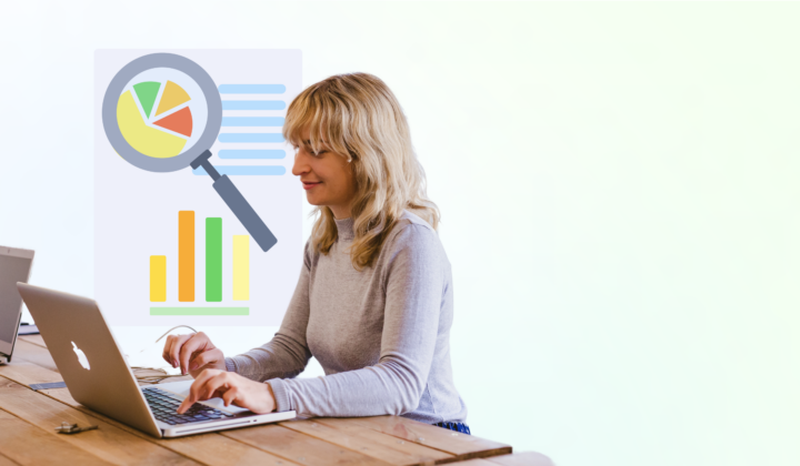 a woman working on her laptop with graphs in the background showing hiring compliance data