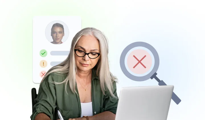 A woman taking notes in front of her laptop with a magnifying glass and checklist in the background