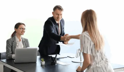 candidate shaking hands with an employer