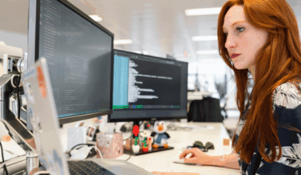 woman coding in office