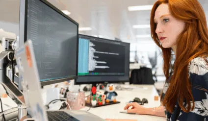 woman coding in office
