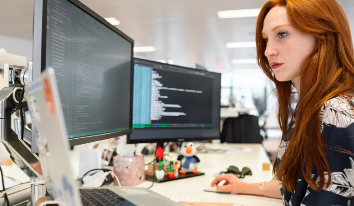 woman coding in office