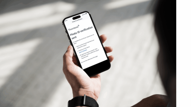 Person on mobile phone submitting ID verification to Thorntons via Amiqus
